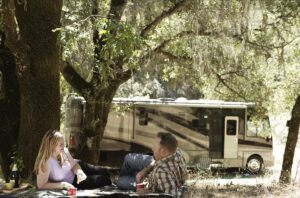 RVing couple outside their motorhome
